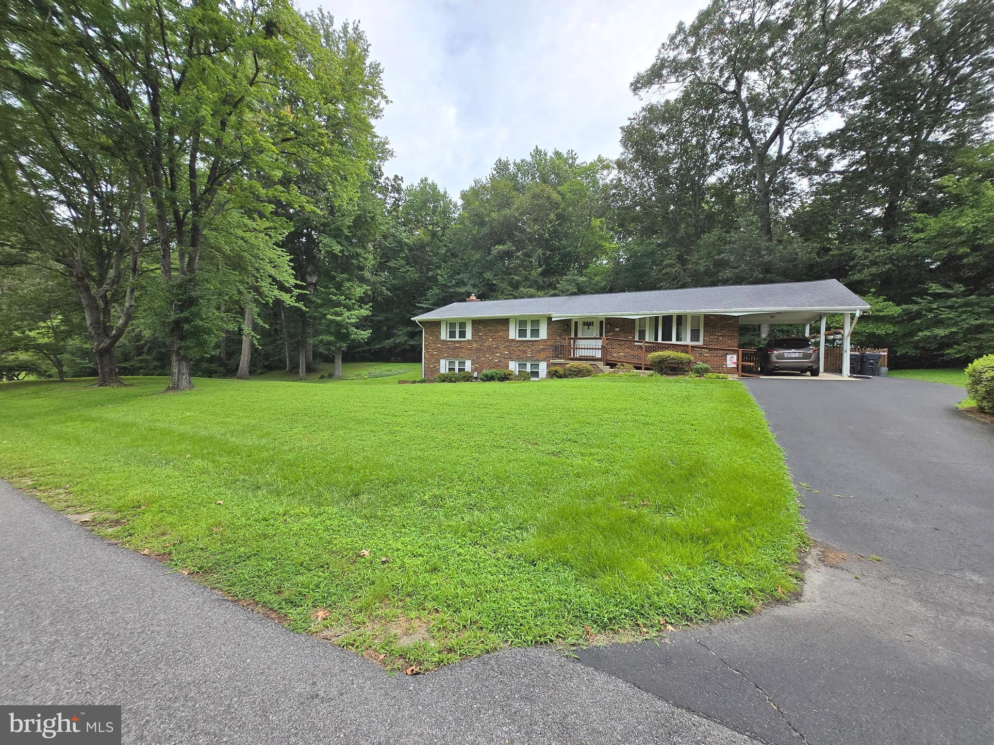 3908 Lakeside Court Dunkirk, MD 20754 - Photo 1 of 22 a view of a house with garden and trees
