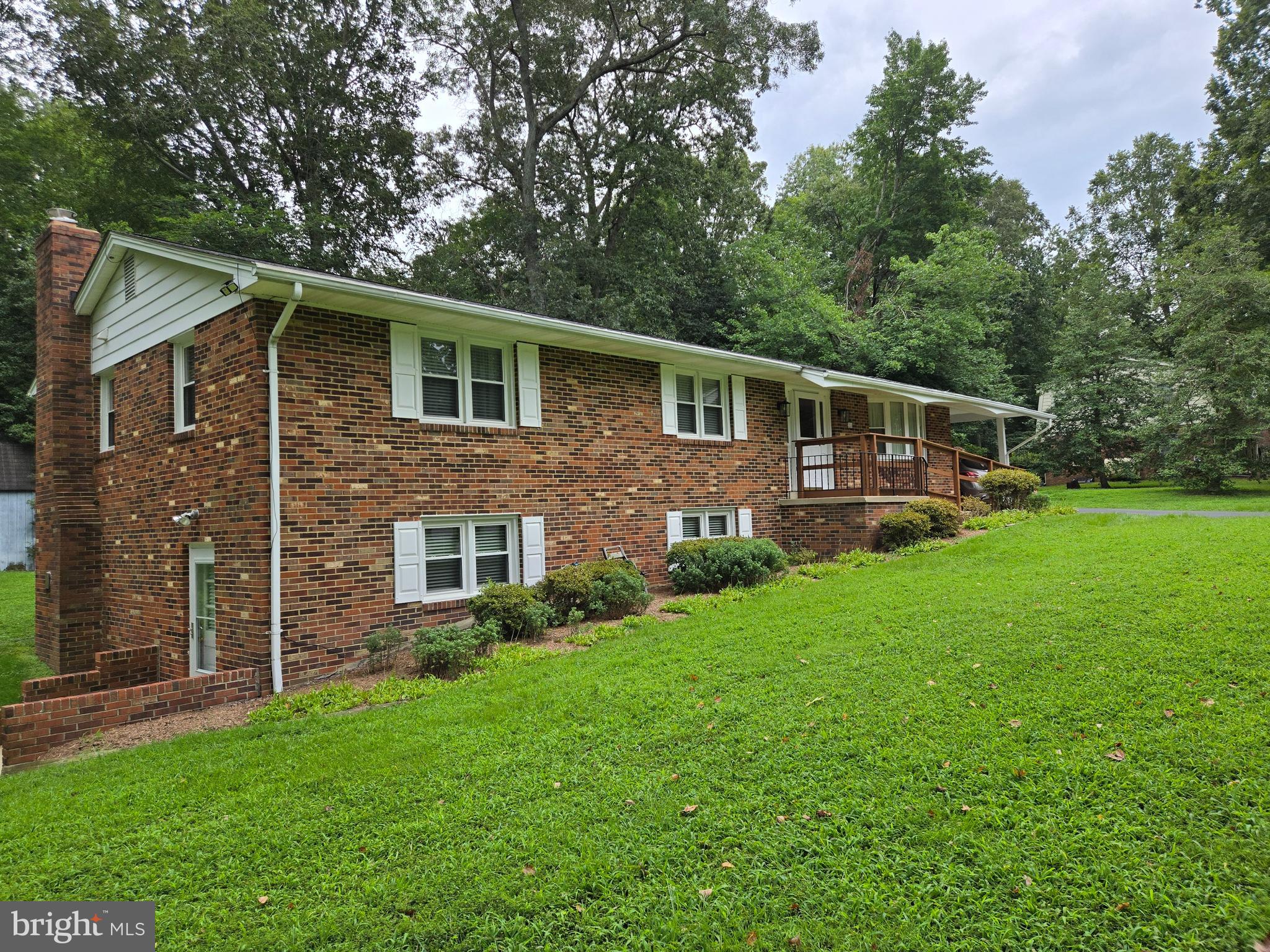 3908 Lakeside Court Dunkirk, MD 20754 - Photo 19 of 22 a front view of a house with a yard and green space