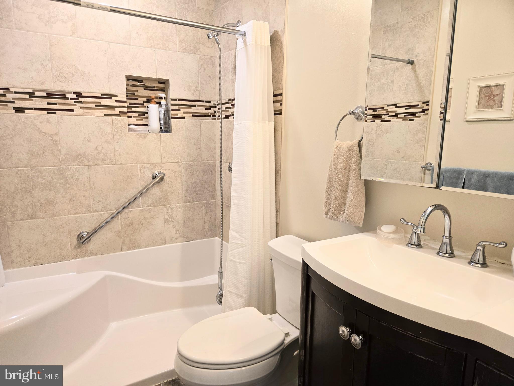 3908 Lakeside Court Dunkirk, MD 20754 - Photo 7 of 22 a bathroom with a sink toilet and shower