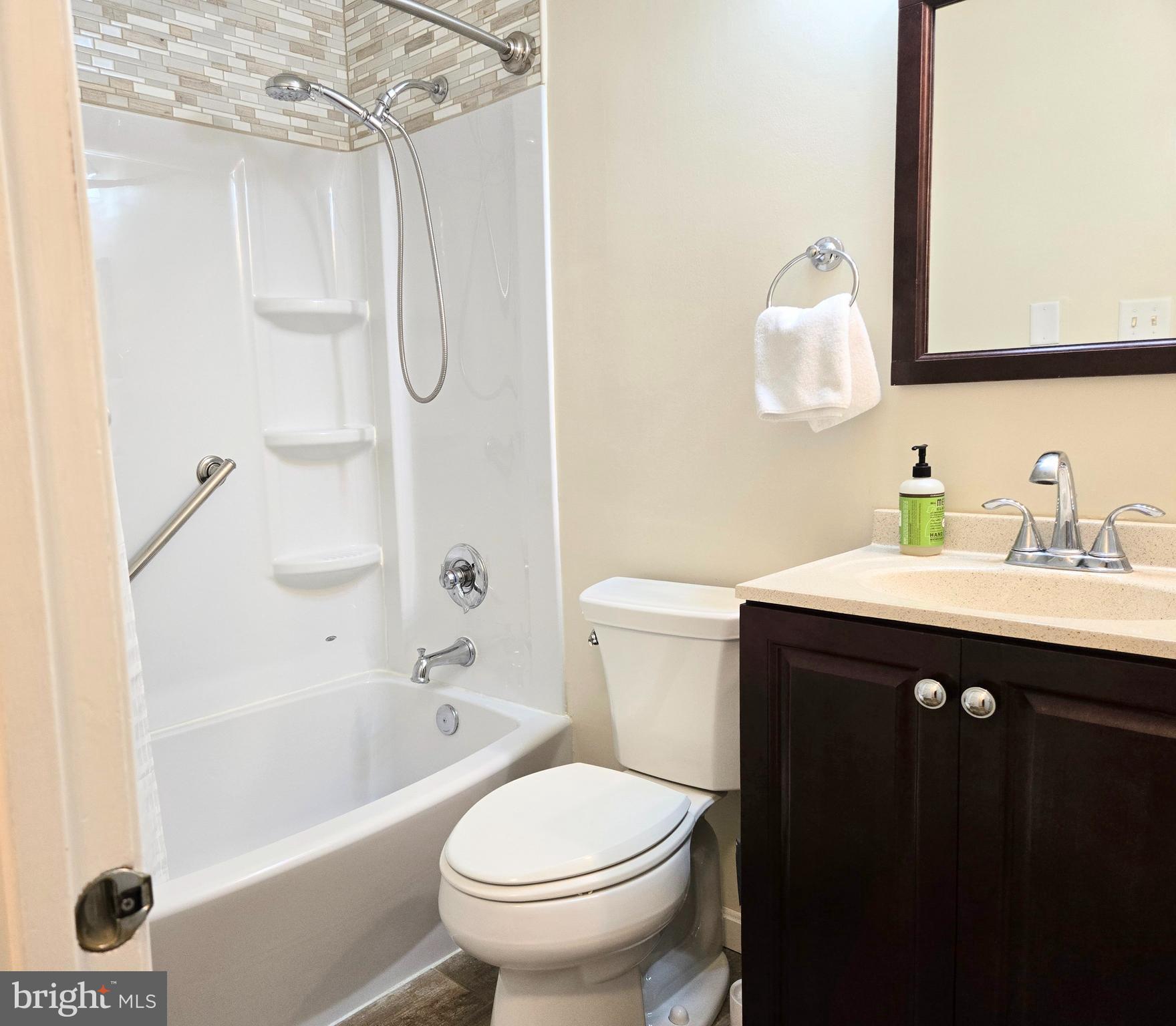 3908 Lakeside Court Dunkirk, MD 20754 - Photo 10 of 22 a bathroom with a sink vanity mirror and toilet