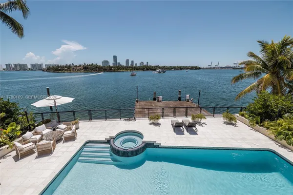 a view of a lake with furniture