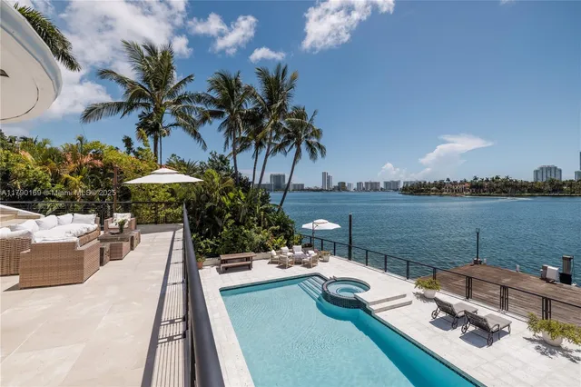 a view of a swimming pool and lounge chair