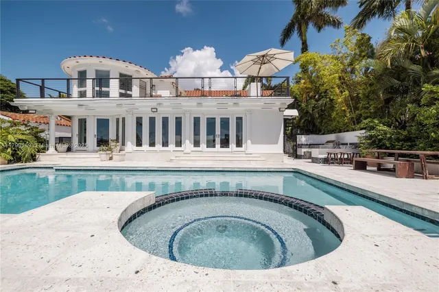 a view of a house with swimming pool