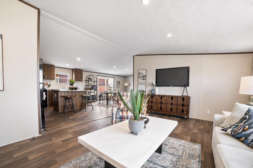 332 Huddleston Road Sunset, TX 76270 - Photo 4 of 28 a living room with furniture and a flat screen tv