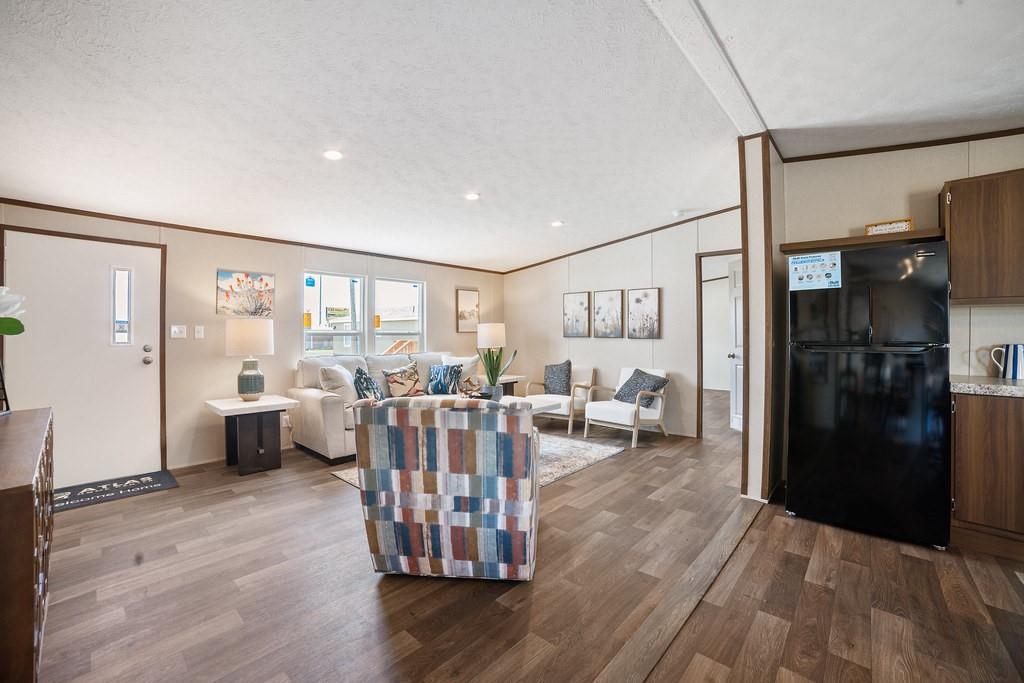 332 Huddleston Road Sunset, TX 76270 - Photo 7 of 28 a living room with furniture and a large window