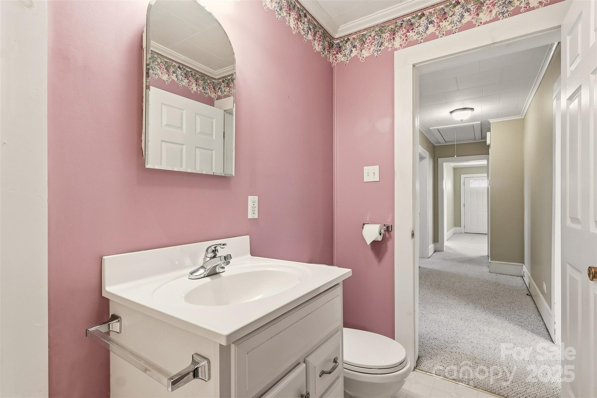 1640 Long Ferry Road Salisbury, NC 28146 - Photo 14 of 47 a bathroom with a sink a toilet a mirror and vanity