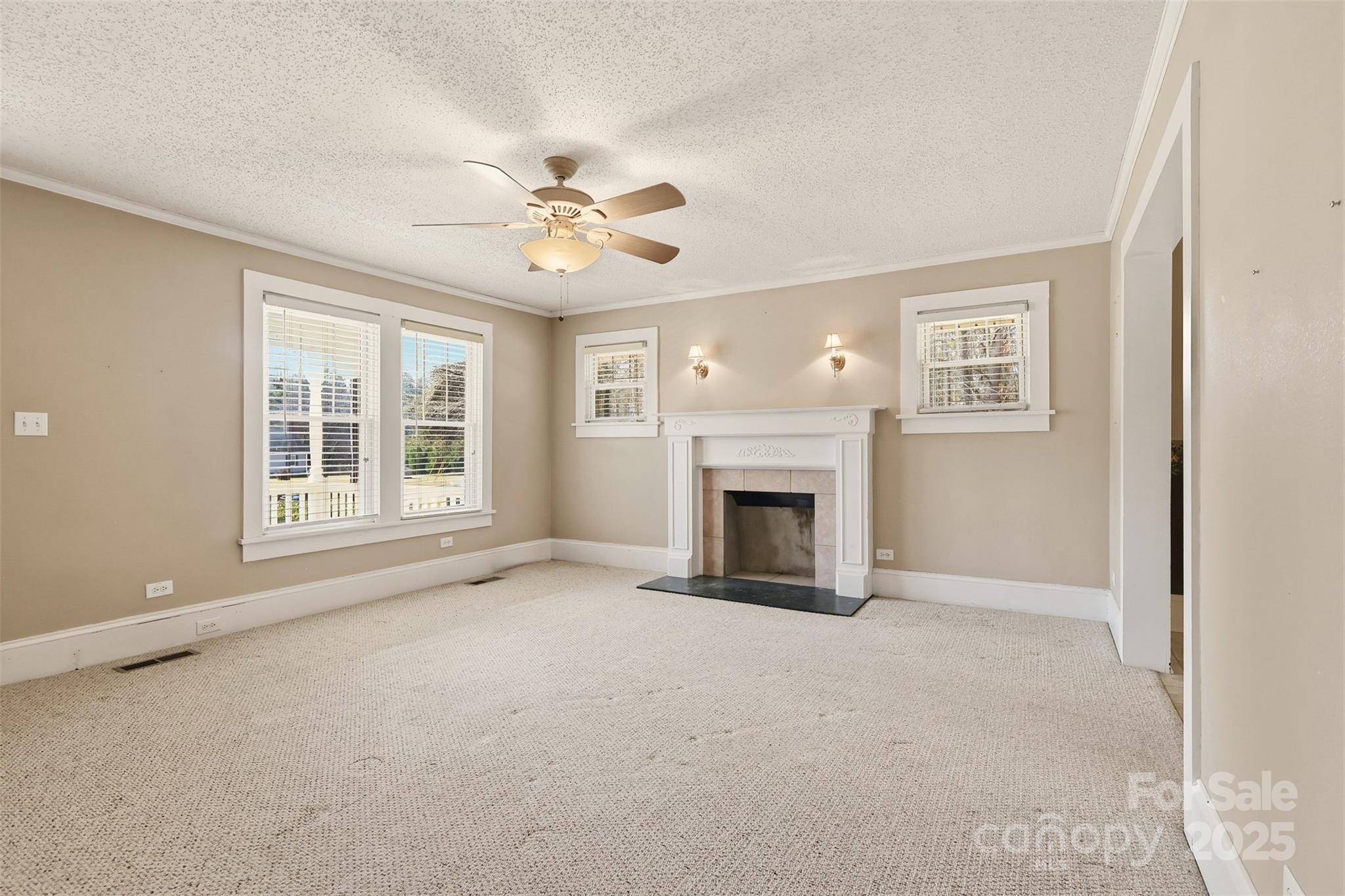 1640 Long Ferry Road Salisbury, NC 28146 - Photo 17 of 47 an empty room with windows fireplace and a sink