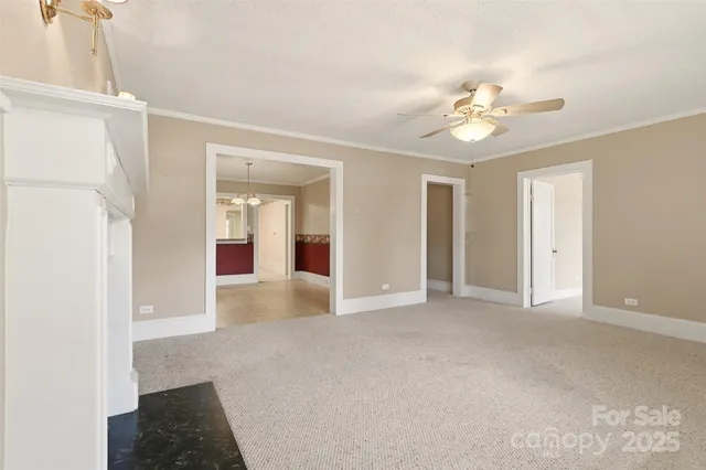 a view of an empty room with a fireplace