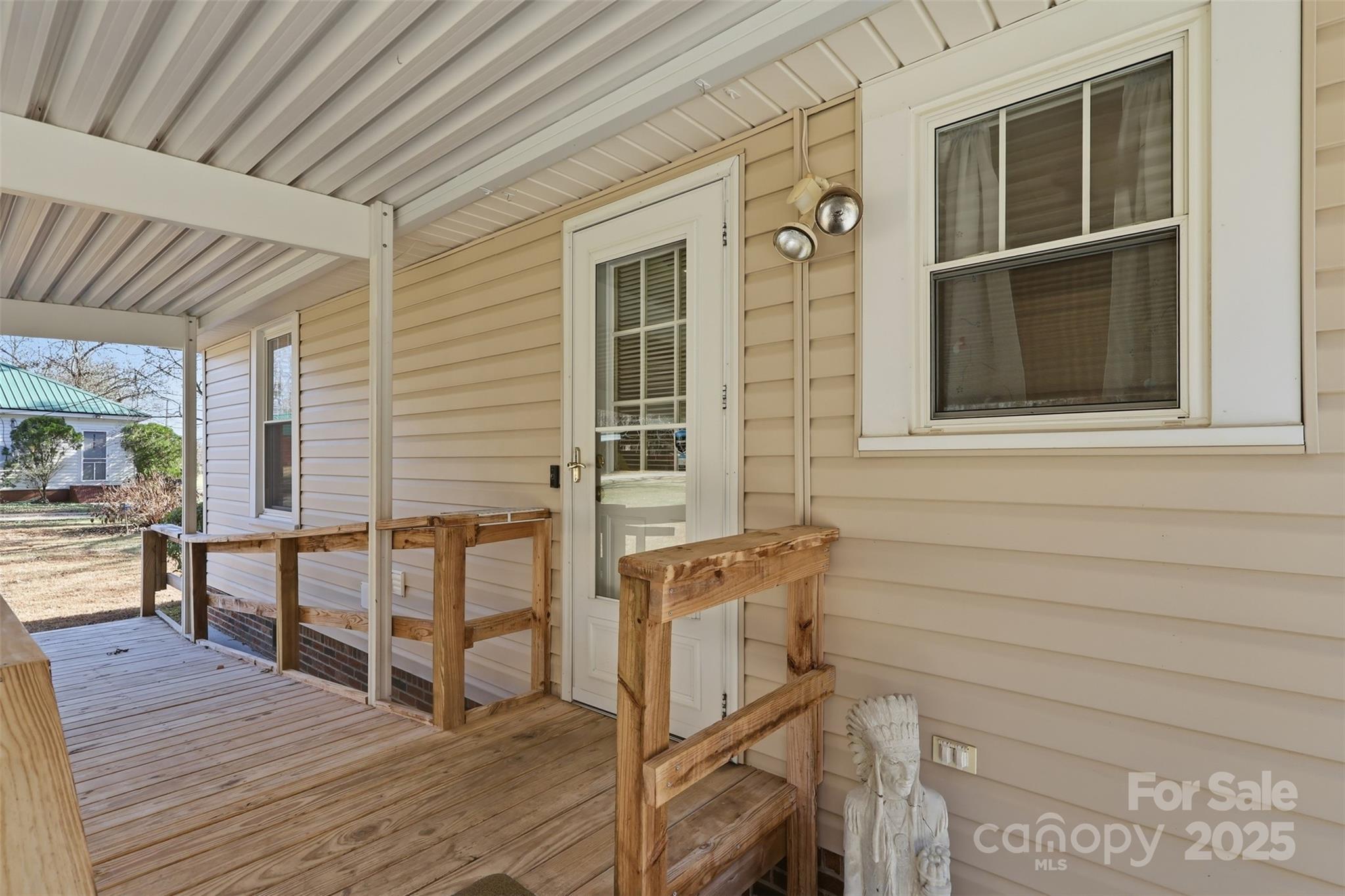 1640 Long Ferry Road Salisbury, NC 28146 - Photo 27 of 47 a view of a deck with wooden floor and iron stairs
