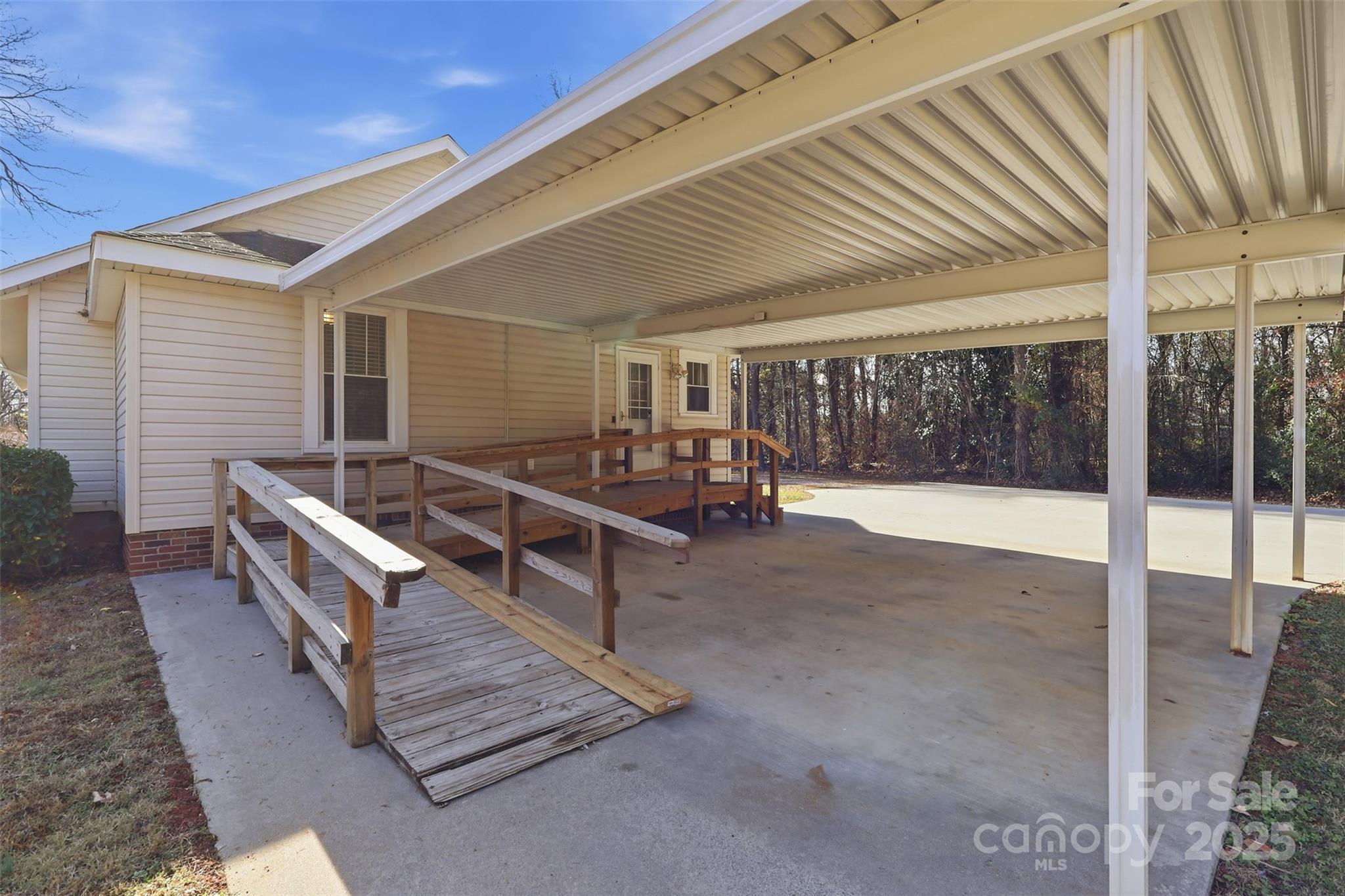 1640 Long Ferry Road Salisbury, NC 28146 - Photo 35 of 47 a view of a patio with table and chairs with wooden floor and fence