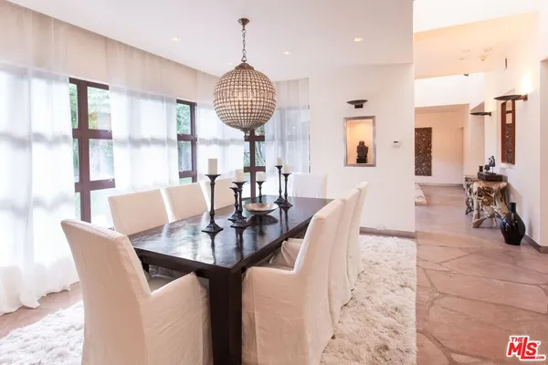 a view of a dining room with furniture