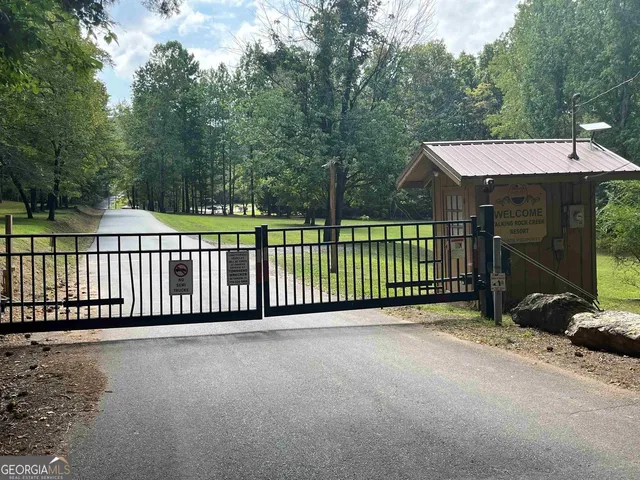 a view of a fence that has a small yard