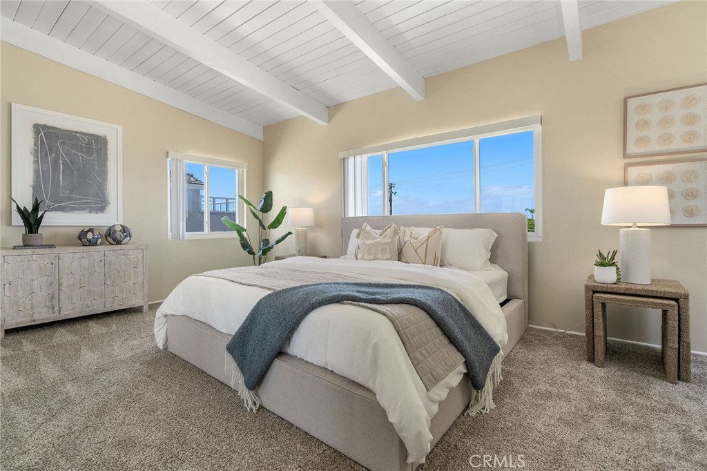 19 B Surfside Surfside, CA 90743 - Photo 19 of 35 a bedroom with a bed and wooden floor