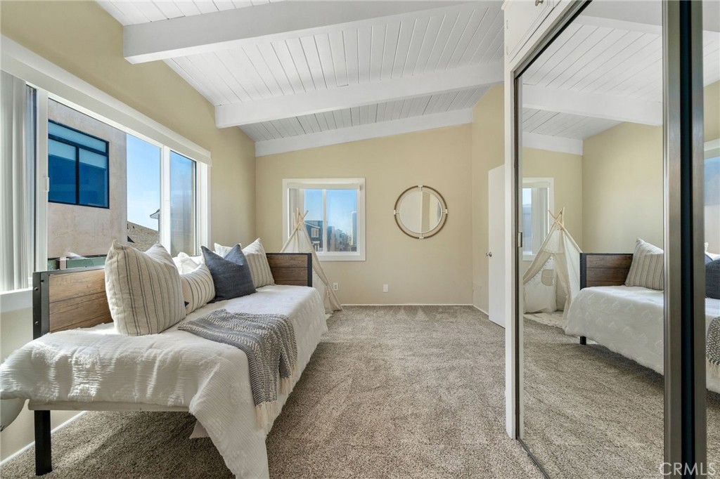 19 B Surfside Surfside, CA 90743 - Photo 21 of 35 a bedroom with a bed and a mirror