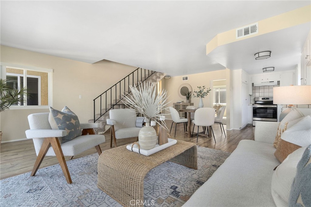 19 B Surfside Surfside, CA 90743 - Photo 4 of 35 a living room with furniture and a wooden floor