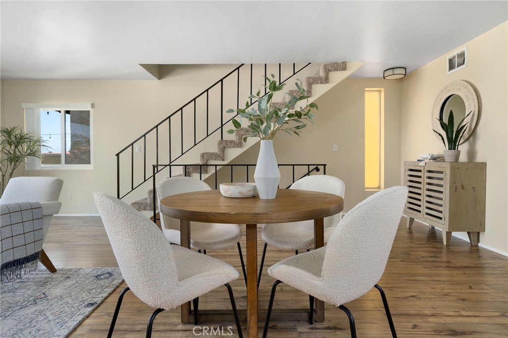 19 B Surfside Surfside, CA 90743 - Photo 6 of 35 a view of a dining room with furniture and wooden floor