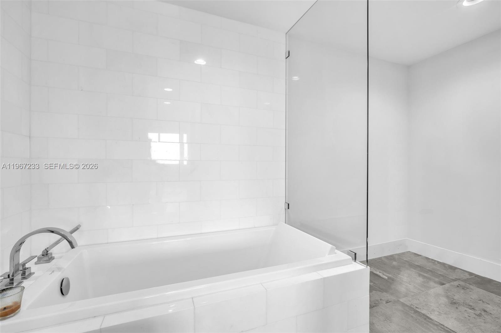 7135 Collins Avenue, Unit 736 Miami Beach, FL 33141 - Photo 19 of 27 a bathroom with a bathtub