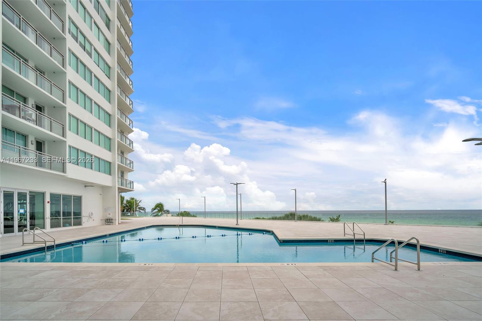 7135 Collins Avenue, Unit 736 Miami Beach, FL 33141 - Photo 23 of 27 a view of a terrace with seating area