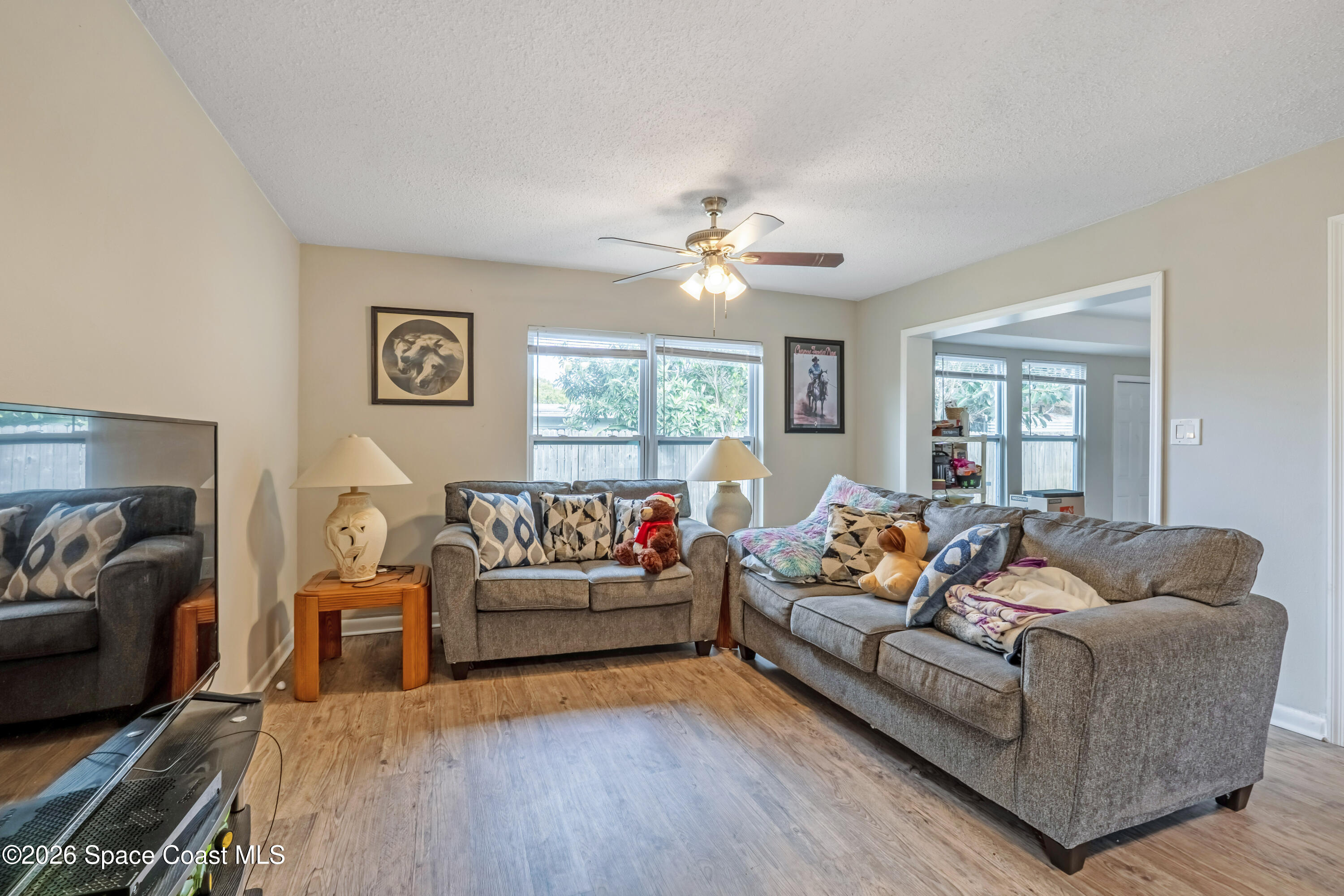 220 Alhambra Street Titusville, FL 32780 - Photo 27 of 29 a living room with furniture and a large window