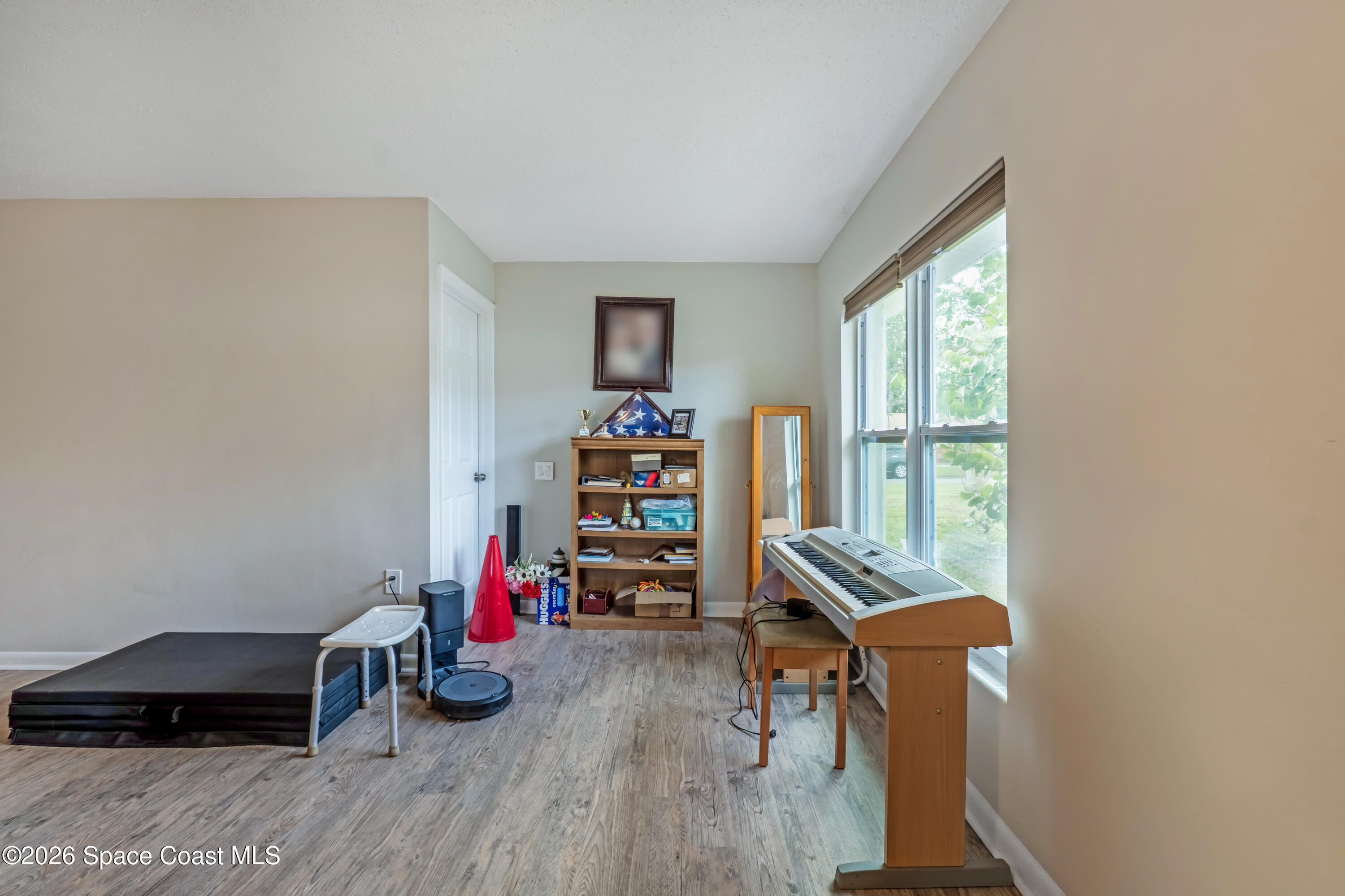 220 Alhambra Street Titusville, FL 32780 - Photo 28 of 29 a view of a workspace with furniture and a window