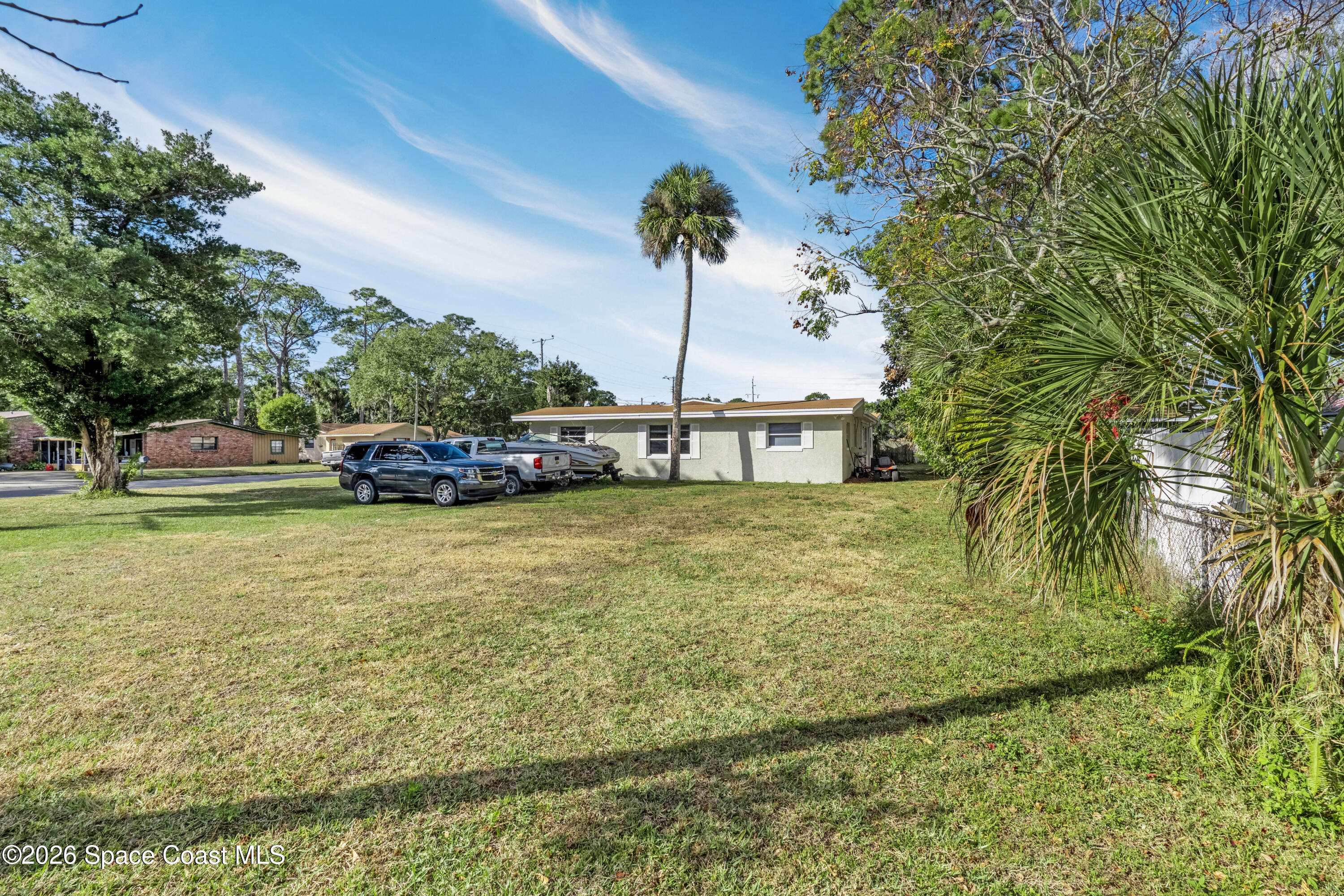 220 Alhambra Street Titusville, FL 32780 - Photo 6 of 29 a house view with a garden space