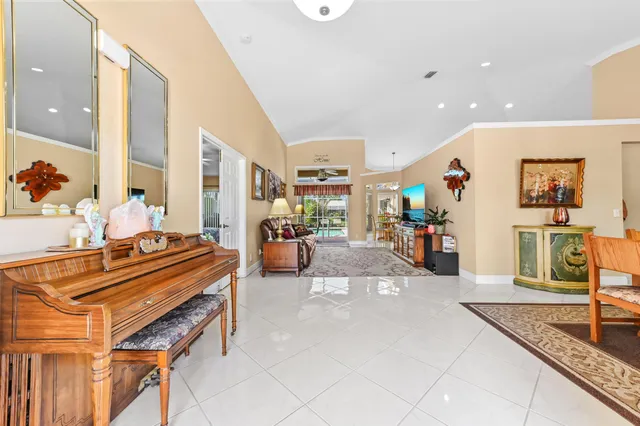 a living room with furniture and flowers