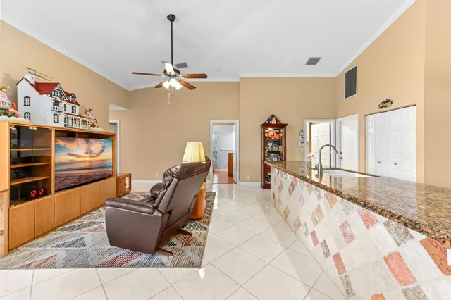 a bathroom with a sink a toilet a mirror and a window