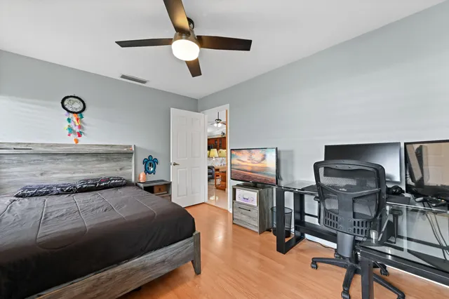 a spacious bathroom with a sink a mirror and a shower