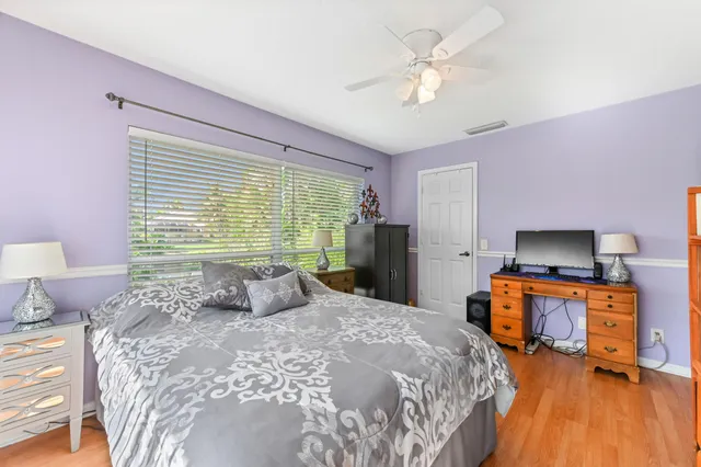 a view of a backyard with a swimming pool