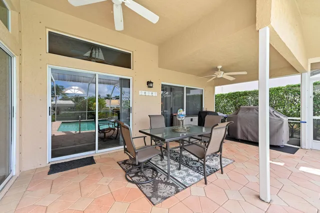 an aerial view of a houses with a lake view