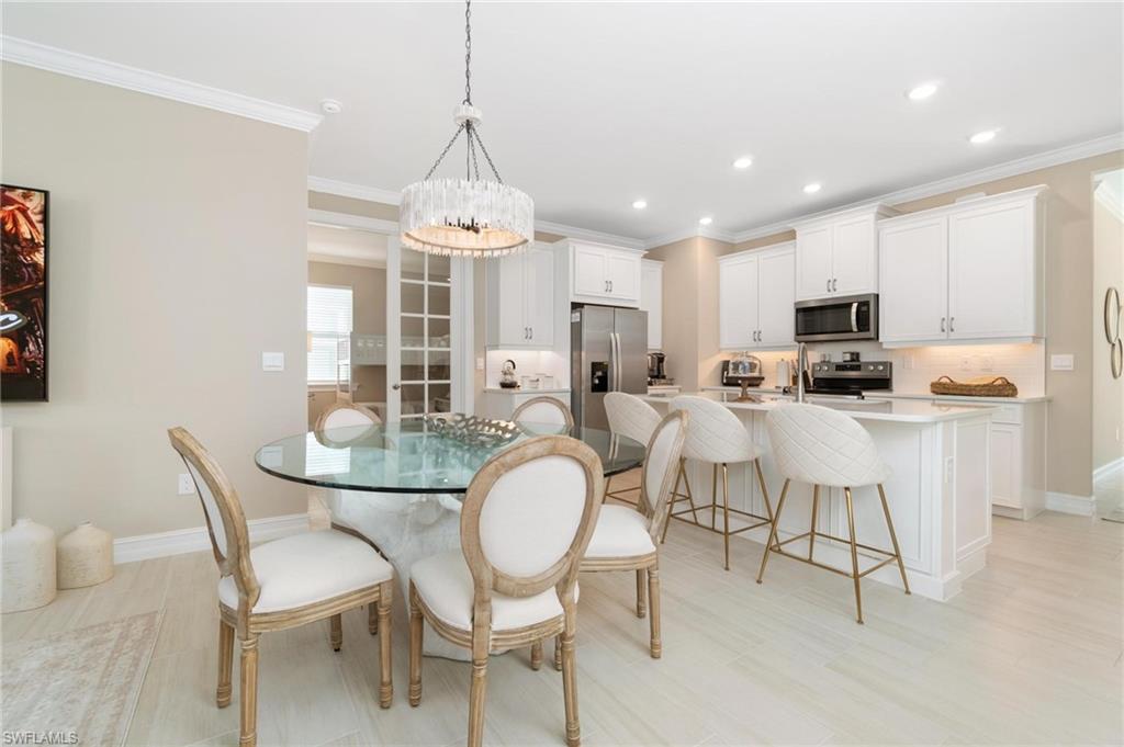28298 Captiva Shell Loop Bonita Springs, FL 34135 - Photo 28 of 49 a view of a dining room with furniture