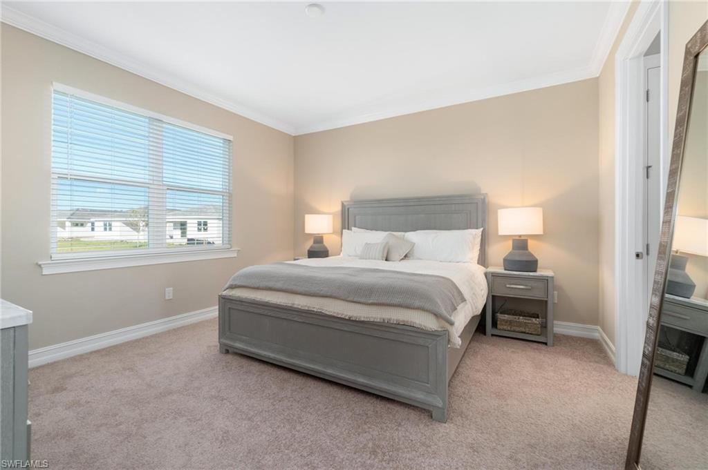 28298 Captiva Shell Loop Bonita Springs, FL 34135 - Photo 32 of 49 a bedroom with a bed and a window