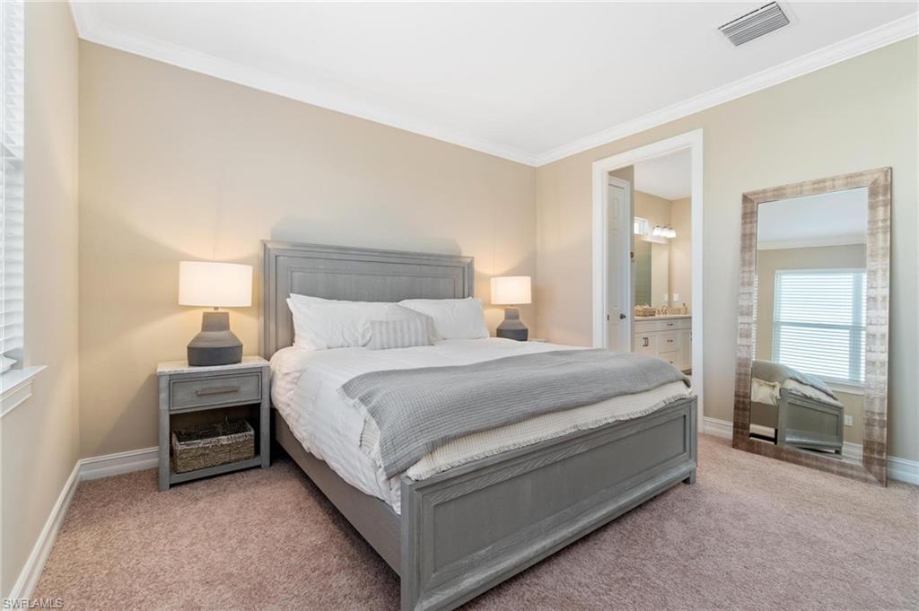 28298 Captiva Shell Loop Bonita Springs, FL 34135 - Photo 33 of 49 a bed room with a bed and a chair