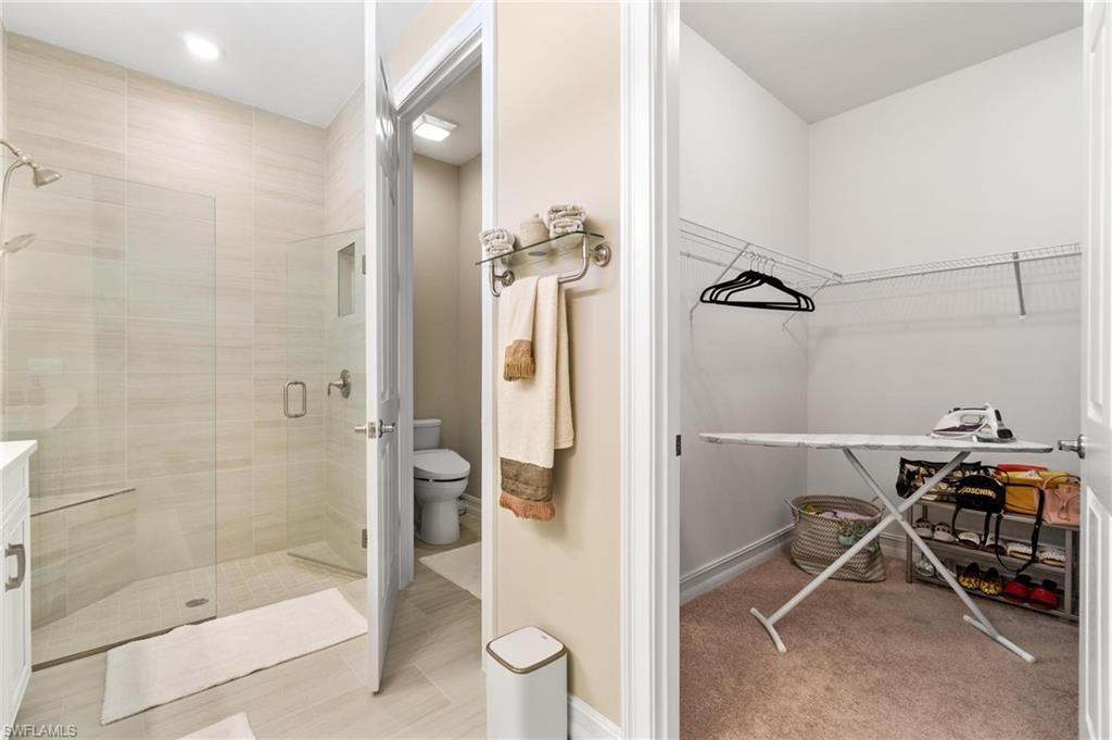 28298 Captiva Shell Loop Bonita Springs, FL 34135 - Photo 38 of 49 a bathroom with a shower and a sink