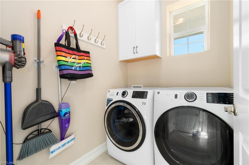 28298 Captiva Shell Loop Bonita Springs, FL 34135 - Photo 42 of 49 a utility room with dryer and washer