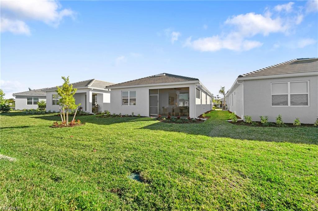 28298 Captiva Shell Loop Bonita Springs, FL 34135 - Photo 47 of 49 a front view of house with yard and green space