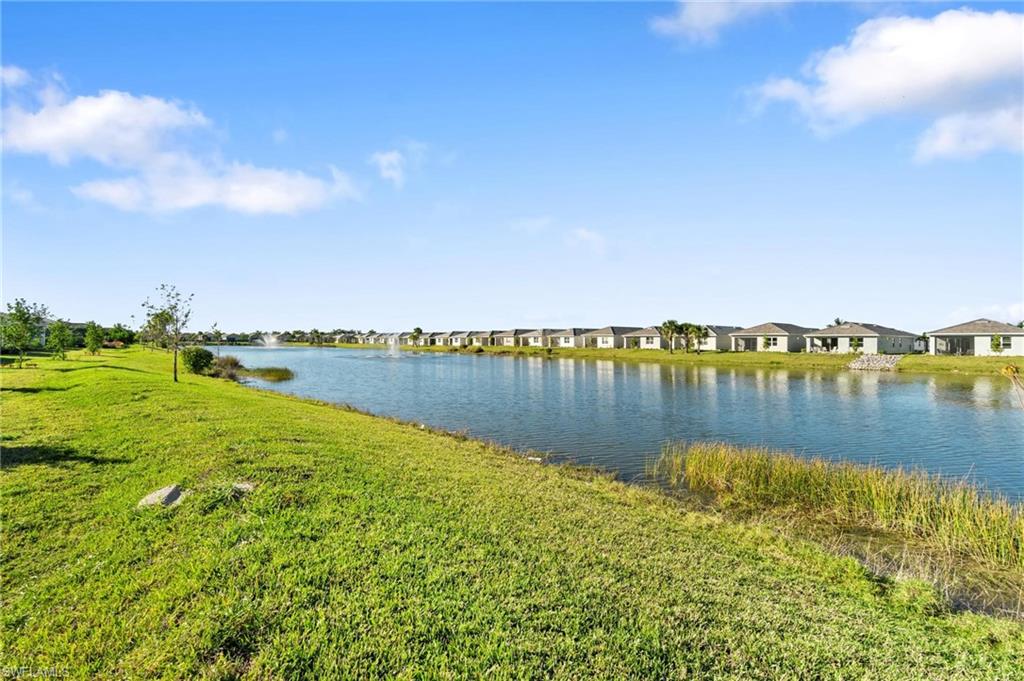 28298 Captiva Shell Loop Bonita Springs, FL 34135 - Photo 48 of 49 a view of a lake with houses in the back