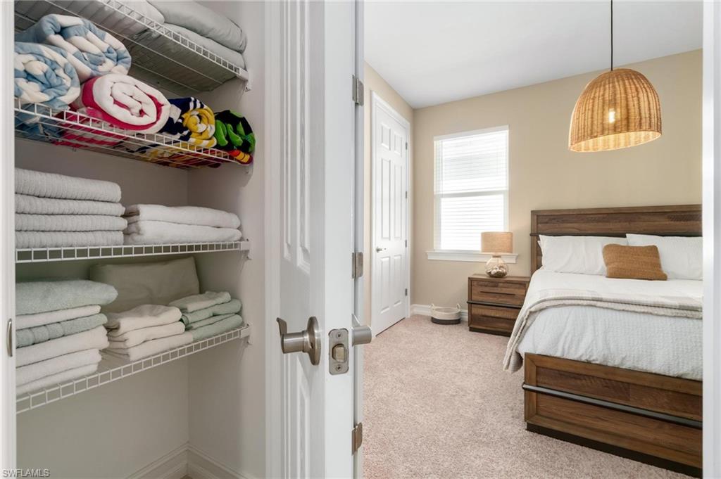 28298 Captiva Shell Loop Bonita Springs, FL 34135 - Photo 9 of 49 a bedroom with a bed and a window