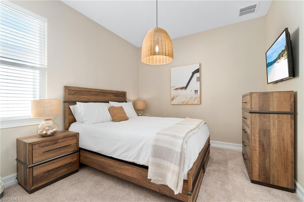 28298 Captiva Shell Loop Bonita Springs, FL 34135 - Photo 10 of 49 a bedroom with bed and a window