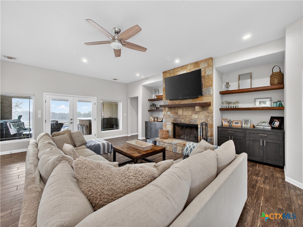 494 Flash Circle Luling, TX 78648 - Photo 6 of 44 a living room with furniture fireplace and a flat screen tv