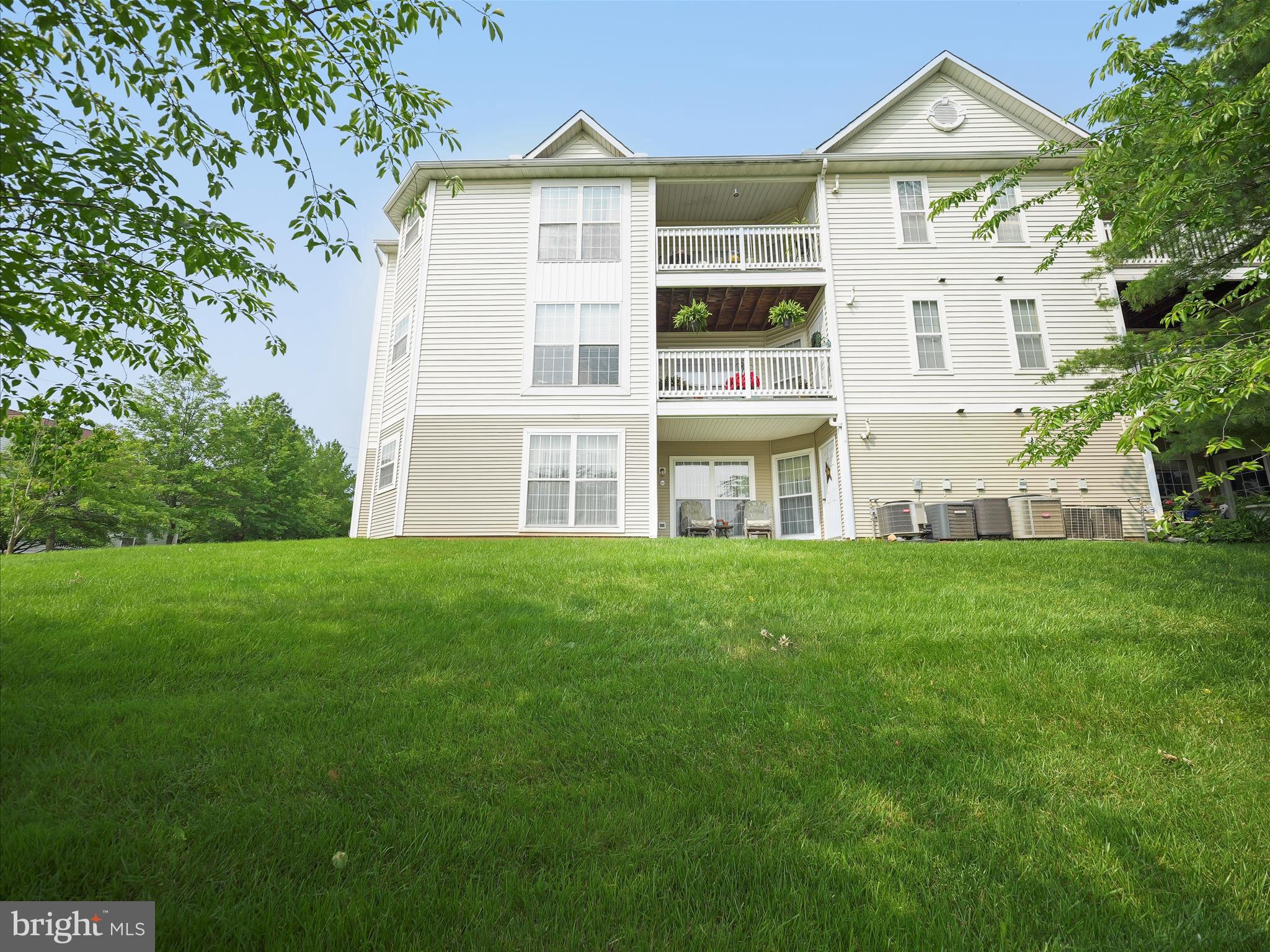 2103 Wayside Drive, Unit 1C Frederick, MD 21702 - Photo 26 of 29 a front view of a house with a yard