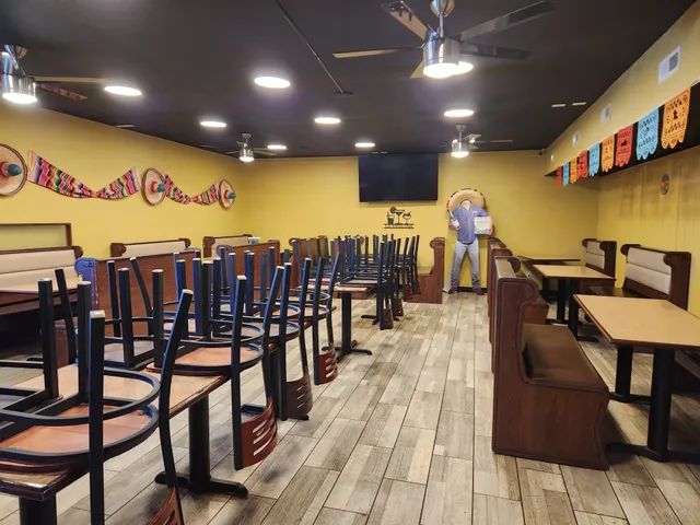 a view of a dining hall with many windows