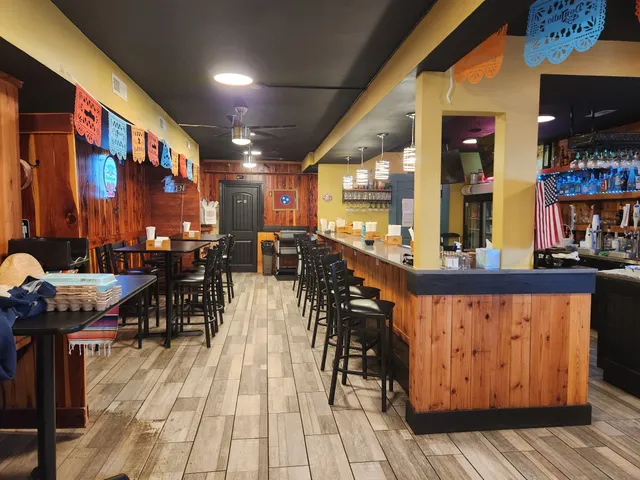 a view of a room with furniture and wooden floor