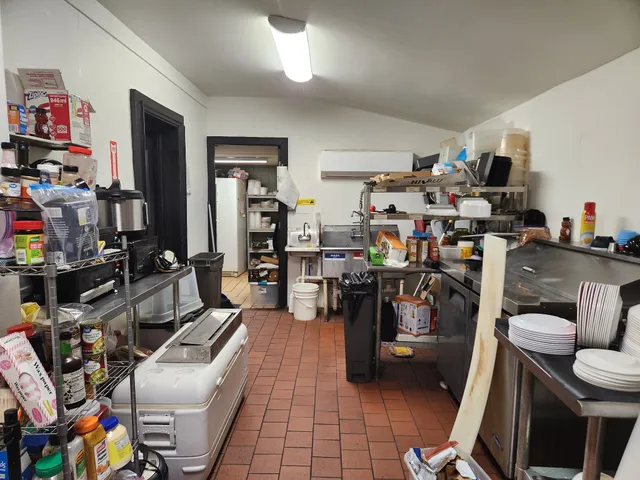 a kitchen with stainless steel appliances lots of counter space and breakfast area