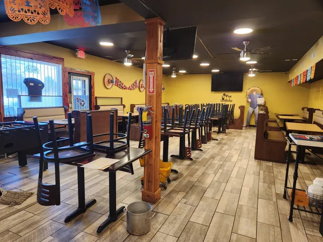 a view of a chairs and table in a gym