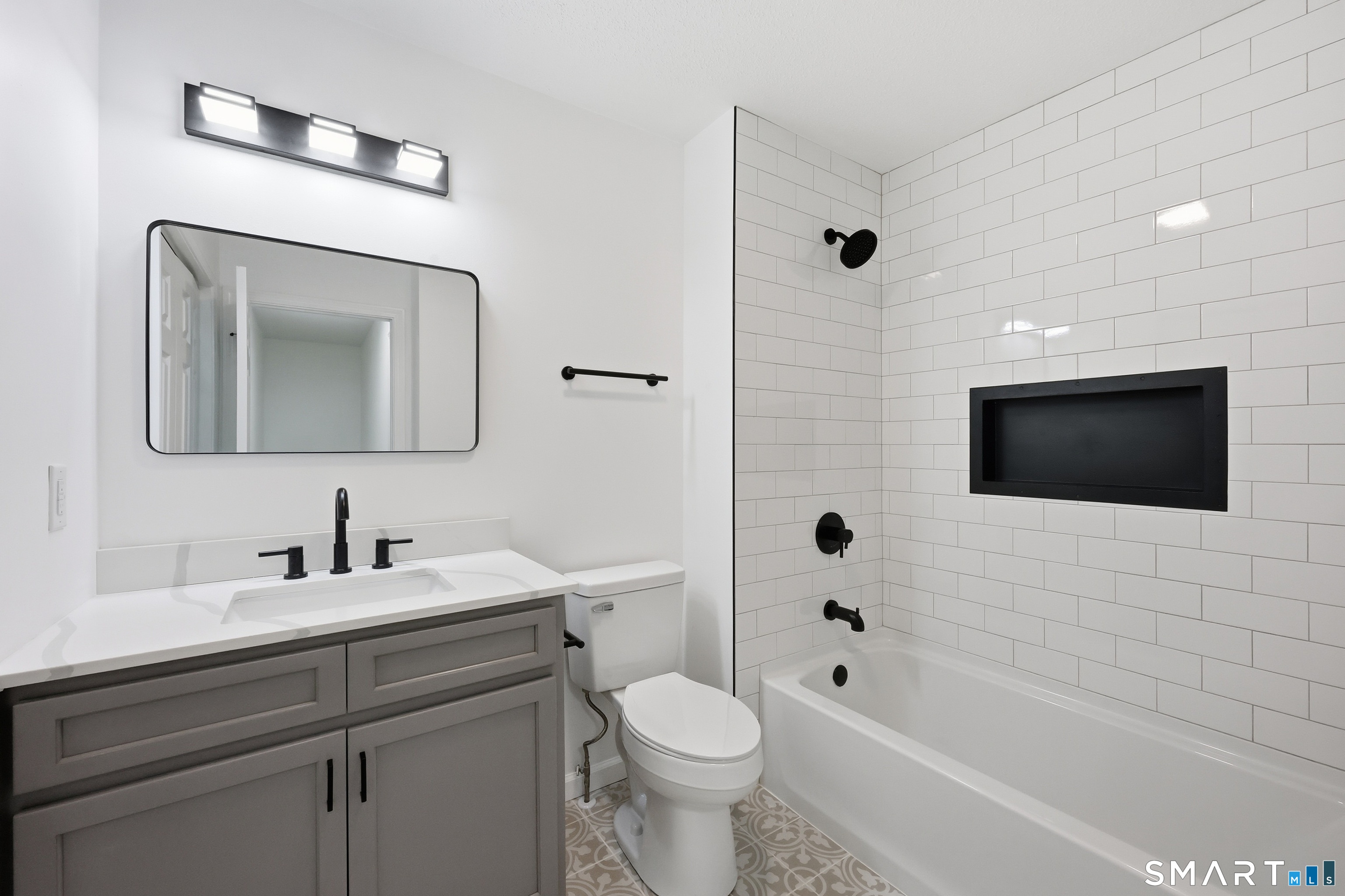 70 Victoria Court Hamden, CT 06514 - Photo 13 of 30 a bathroom with a toilet sink and mirror