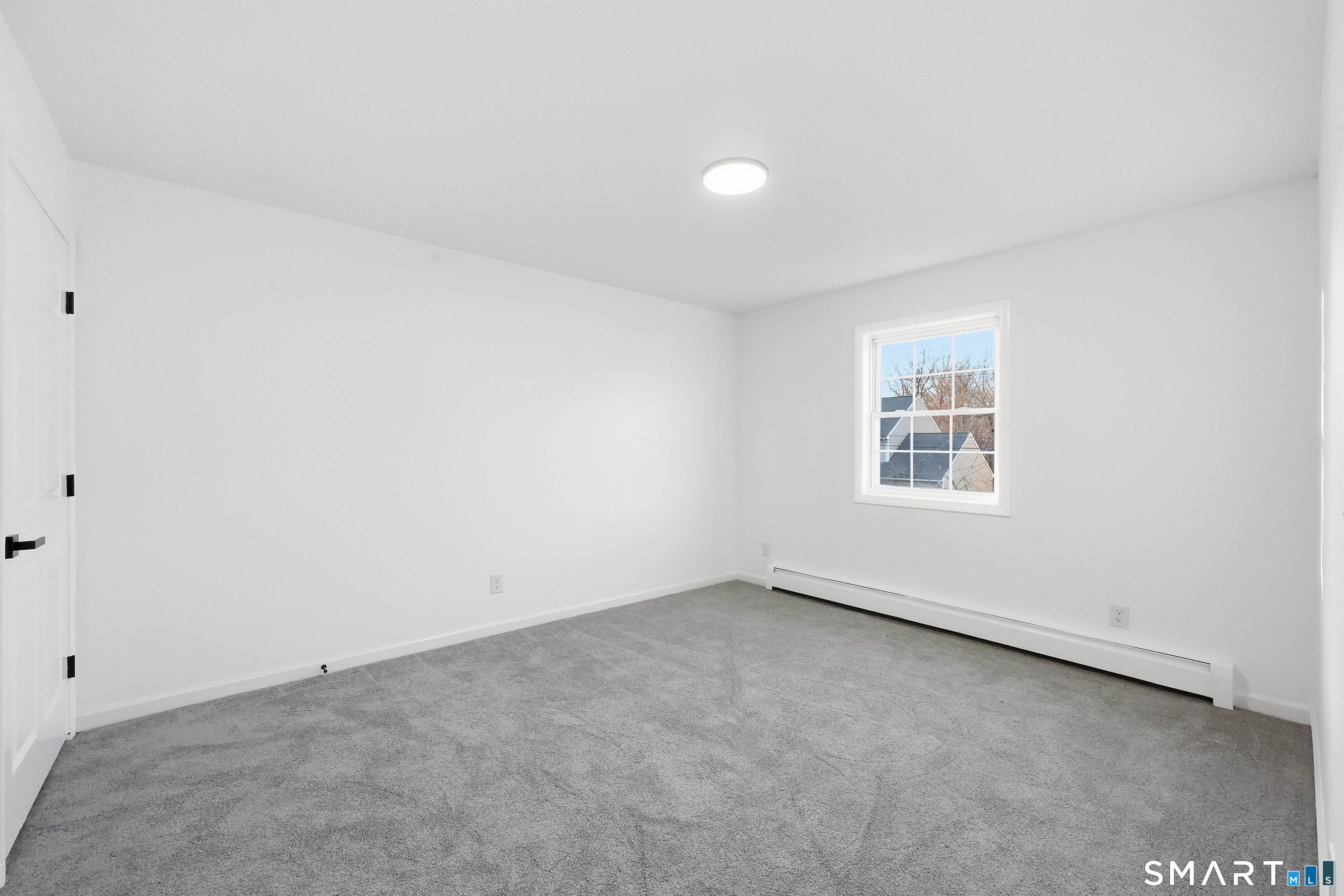 70 Victoria Court Hamden, CT 06514 - Photo 15 of 30 an empty room with windows