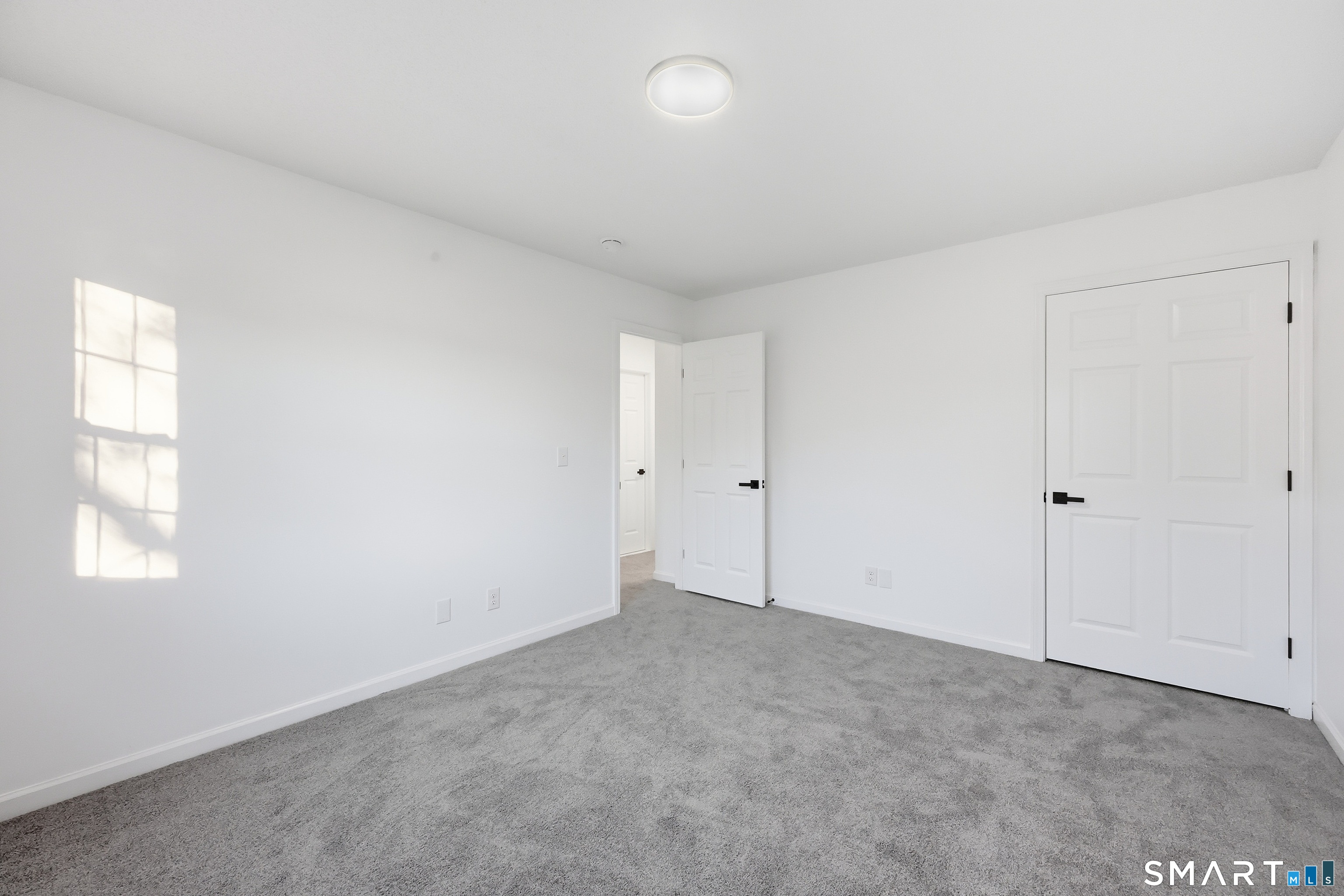 70 Victoria Court Hamden, CT 06514 - Photo 16 of 30 an empty room with windows and closet