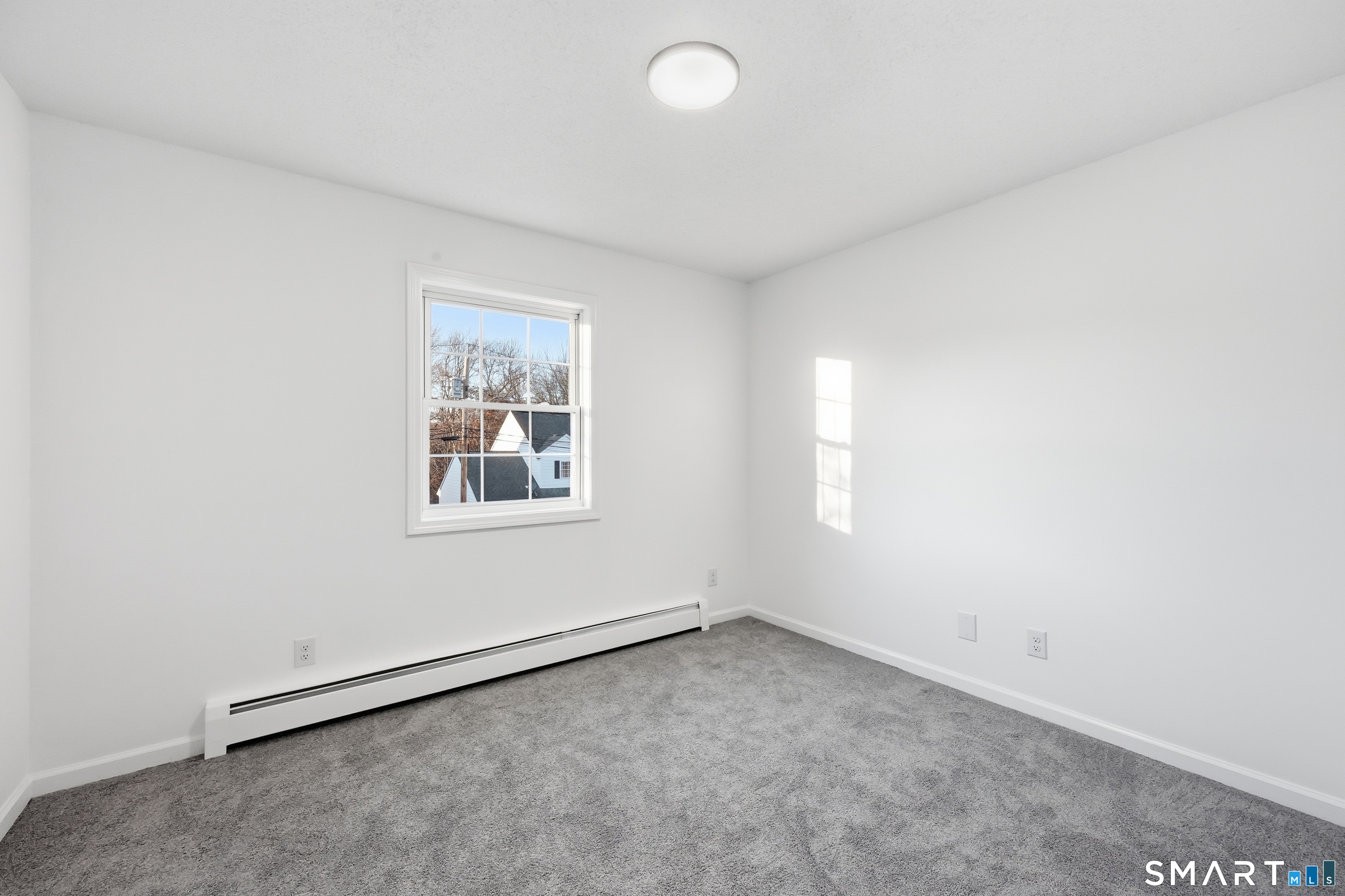 70 Victoria Court Hamden, CT 06514 - Photo 17 of 30 an empty room with a window