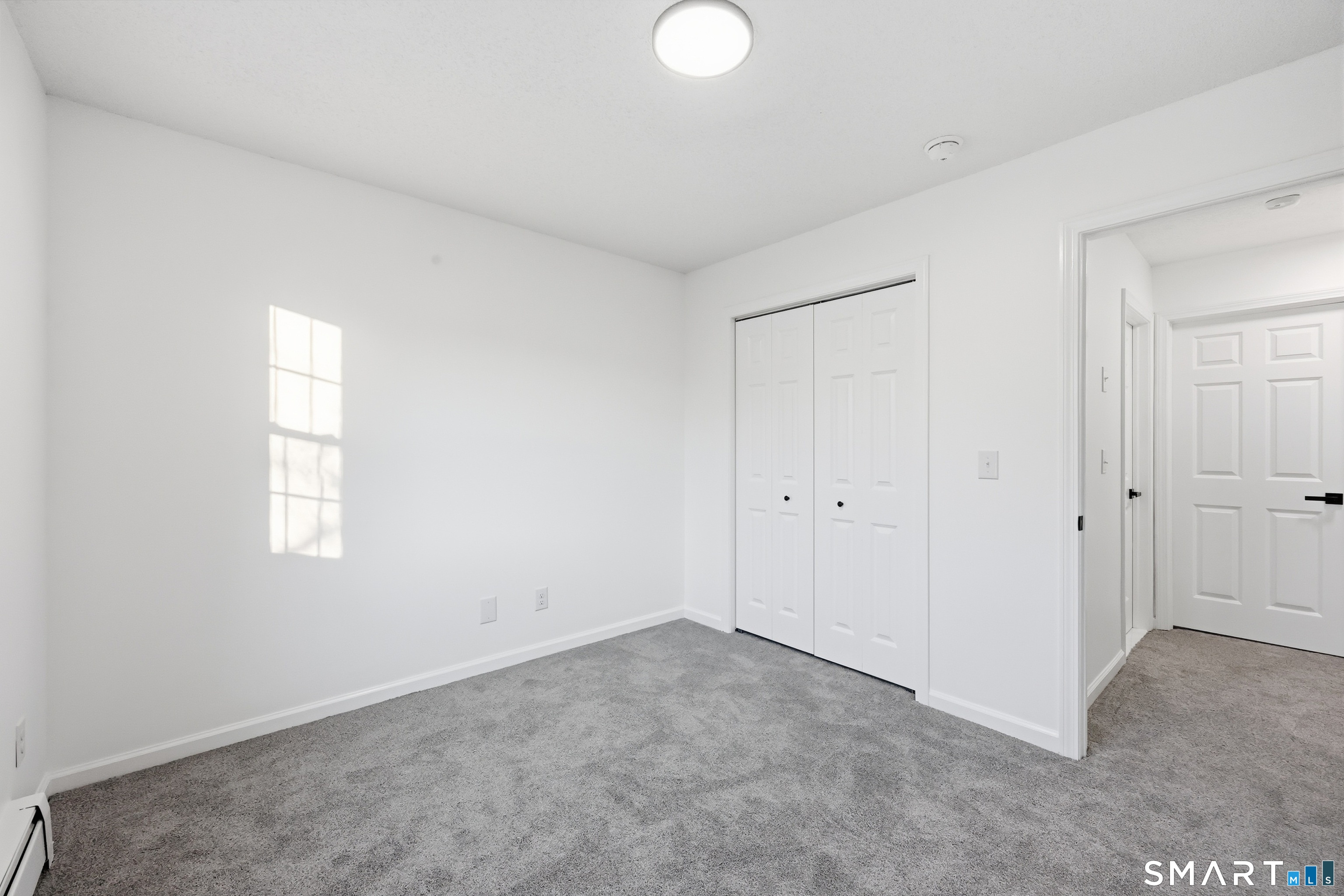 70 Victoria Court Hamden, CT 06514 - Photo 19 of 30 a view of an empty room and window